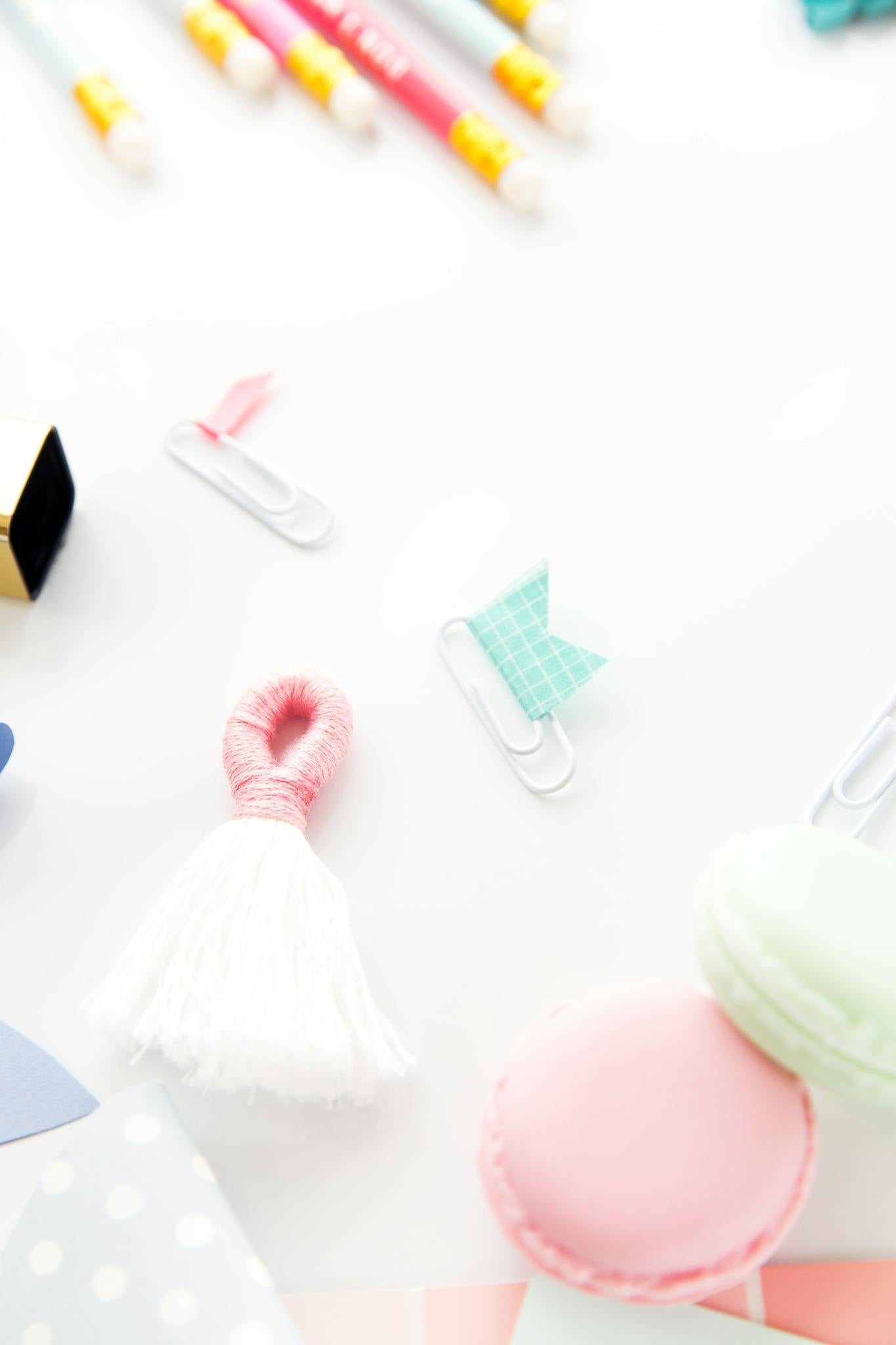 Colorful office supplies arranged on a white background, showcasing a playful, creative workspace vibe.
